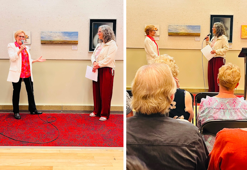 Two women talking to each other at a formal presentation